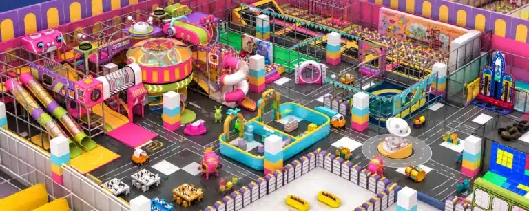 Custom indoor playground with slides, climbing structures and multiple activity zones